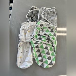 Set of 4 Velcro swaddles. Fit NB+. Play condition.